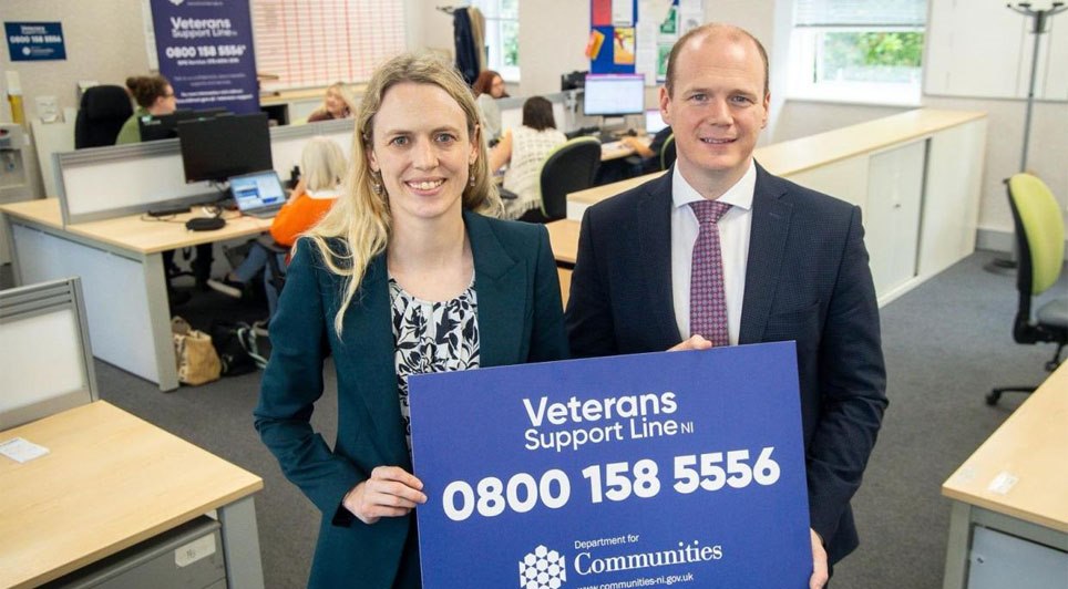 Ministers Lyons and Sandher-Jones review the newly launched Veterans Support Line NI